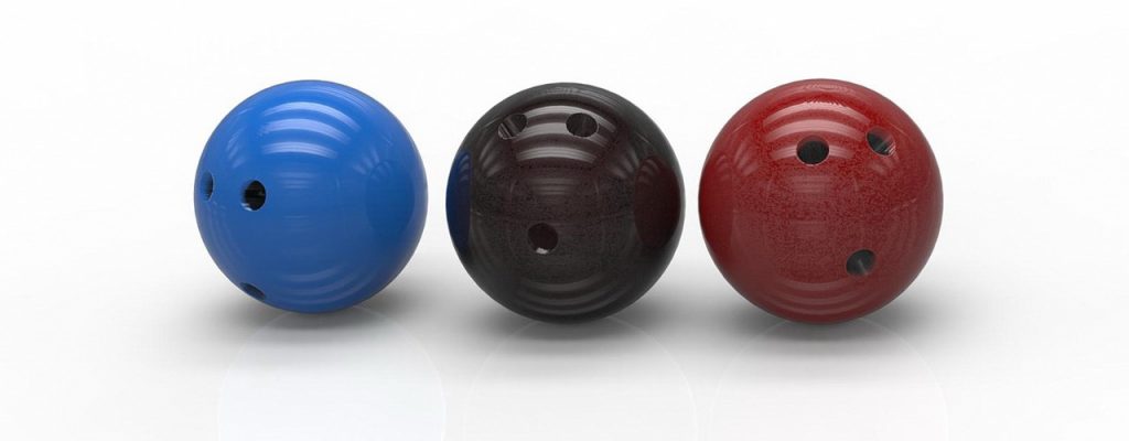 Three different color (blue, black, red) bowling balls - Post picture for How to choose a bowling ball beginners guide